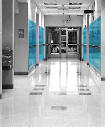 looking down a school hallway lined with blue lockers