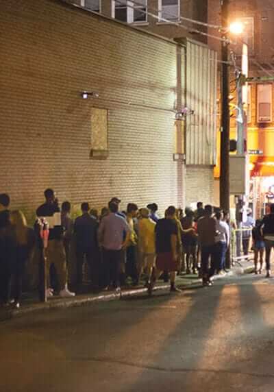 College students in line for a club in downtown Morgantown.