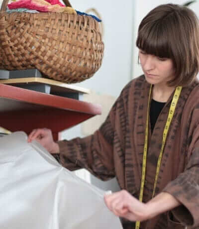 Nellie Rose Davis measuring out silk