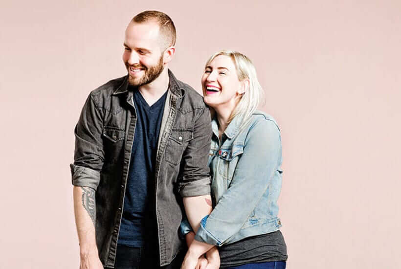 Emily Porter and Bobby Oberlander holding hands and laughing