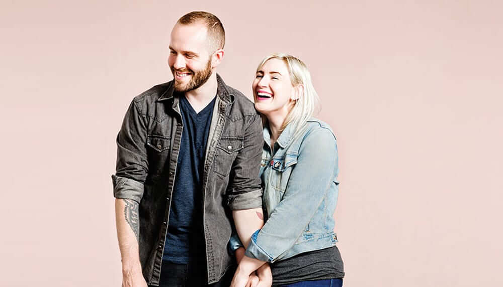 Emily Porter and Bobby Oberlander holding hands and laughing