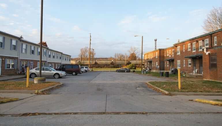 parking lot next to housing complexes